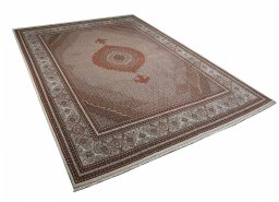 Corner detail of New Tabriz rug showing border pattern and Cork pile