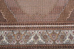 Backside of handmade New Tabriz rug showing knot structure and weave density
