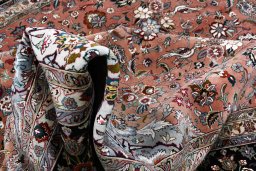 Corner detail of New Tabriz rug showing border pattern and Cork pile