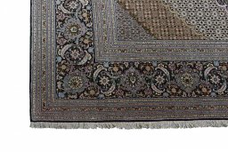 Backside of handmade New Tabriz rug showing knot structure and weave density
