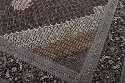 Backside of handmade New Tabriz rug showing knot structure and weave density