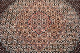 Corner detail of New Tabriz rug showing border pattern and Cork pile