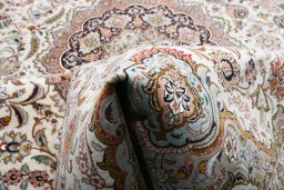Backside of handmade New Tabriz rug showing knot structure and weave density
