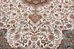 Backside of handmade New Tabriz rug showing knot structure and weave density
