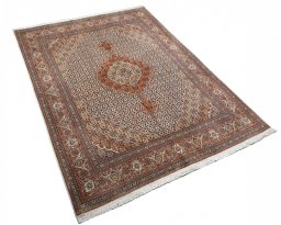 Corner detail of New Tabriz rug showing border pattern and Cork pile