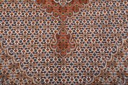 Backside of handmade New Tabriz rug showing knot structure and weave density
