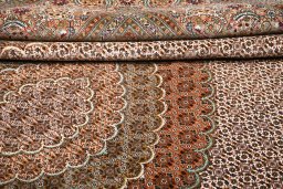 Backside of handmade New Tabriz rug showing knot structure and weave density