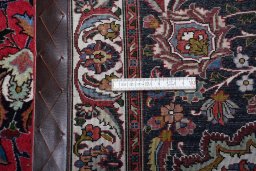 Surface texture of 2000s Tabriz rug with natural Cork and intricate pattern