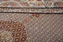 Backside of handmade New Tabriz rug showing knot structure and weave density