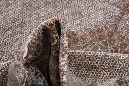 Backside of handmade New Tabriz rug showing knot structure and weave density