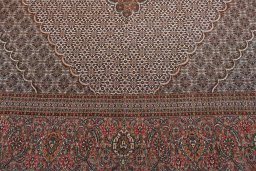 Backside of handmade New Tabriz rug showing knot structure and weave density