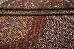 Backside of handmade New Tabriz rug showing knot structure and weave density