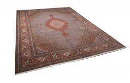 Corner detail of New Tabriz rug showing border pattern and Cork pile