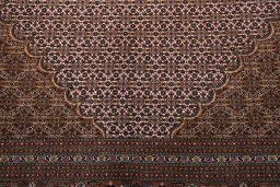 Backside of handmade New Tabriz rug showing knot structure and weave density