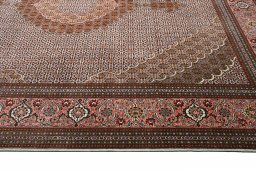 Corner detail of New Tabriz rug showing border pattern and Cork pile