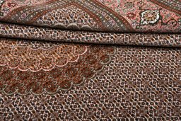 Backside of handmade New Tabriz rug showing knot structure and weave density