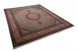 Corner detail of New Tabriz rug showing border pattern and Cork pile