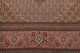 Backside of handmade New Tabriz rug showing knot structure and weave density
