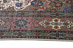 Backside of handmade New Tabriz rug showing knot structure and weave density