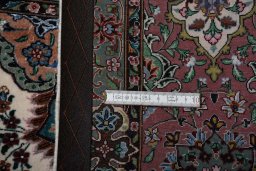 Corner detail of New Tabriz rug showing border pattern and Cork pile