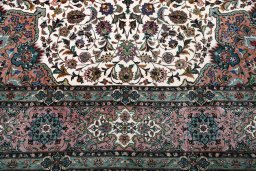 Backside of handmade New Tabriz rug showing knot structure and weave density