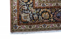 Corner detail of New Tabriz rug showing border pattern and Cork pile