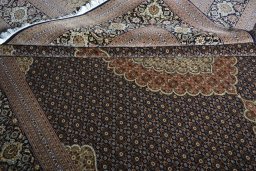 Close-up detail of 2000s Tabriz rug from Iran / Persia showing Cork weave