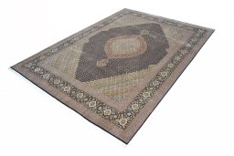Corner detail of 2000s Tabriz rug showing border pattern and Cork pile