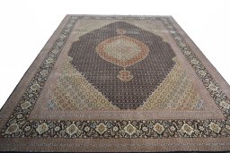 Surface texture of 2000s Tabriz rug with natural Cork and intricate pattern
