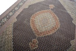Backside of handmade 2000s Tabriz rug showing knot structure and weave density