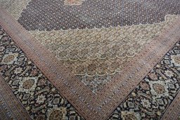 Close-up detail of 2000s Tabriz rug from Iran / Persia showing Cork weave