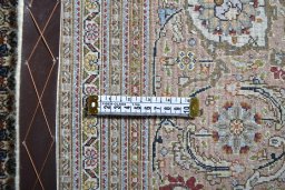 Backside of handmade New Tabriz rug showing knot structure and weave density