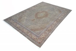Corner detail of New Tabriz rug showing border pattern and Cork pile