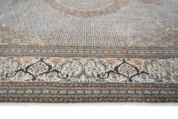 Corner detail of 2000s Tabriz rug showing border pattern and Cork pile