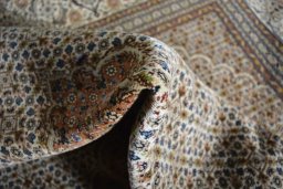 Surface texture of 2000s Tabriz rug with natural Cork and intricate pattern
