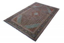 Corner detail of New Tabriz rug showing border pattern and Cork pile