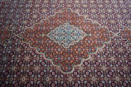 Central medallion detail of New Tabriz rug from Iran / Persia