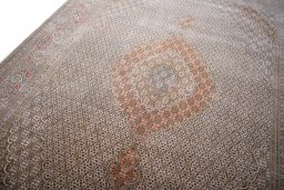 Backside of handmade New Tabriz rug showing knot structure and weave density