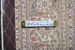 Backside of handmade Unknown Tabriz rug showing knot structure and weave density