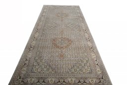 Surface texture of Unknown Tabriz rug with natural Wool and intricate pattern