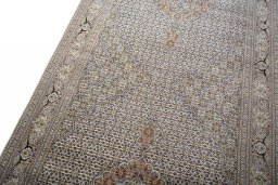 Backside of handmade Unknown Tabriz rug showing knot structure and weave density