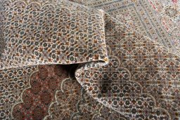 Backside of handmade 2000s Tabriz rug showing knot structure and weave density