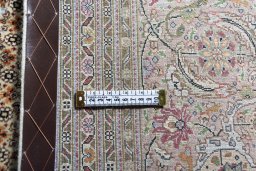 Central medallion detail of 2000s Tabriz rug from Iran / Persia