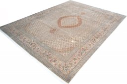 Corner detail of 2000s Tabriz rug showing border pattern and Cork pile