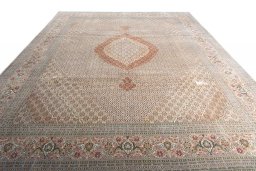 Surface texture of 2000s Tabriz rug with natural Cork and intricate pattern