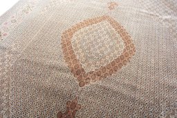 Backside of handmade 2000s Tabriz rug showing knot structure and weave density