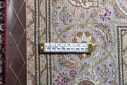 Backside of handmade New Tabriz rug showing knot structure and weave density