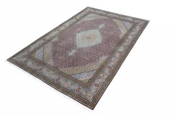 Corner detail of New Tabriz rug showing border pattern and Cork pile
