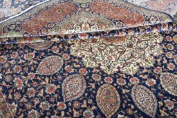Surface texture of 1970s Tabriz rug with natural Wool and intricate pattern