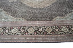 Corner detail of New Tabriz rug showing border pattern and Cork pile
